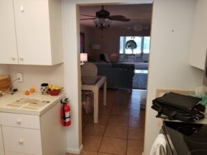Before photo of a narrow kitchen entry way in Bradenton's Meadowcroft condo
