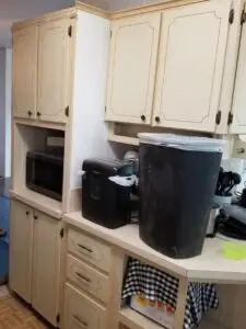 Before photo of an outdated mobile home kitchen in Ellenton