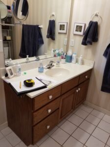 Before photo of dated guest bathroom vanity in Bradenton, FL