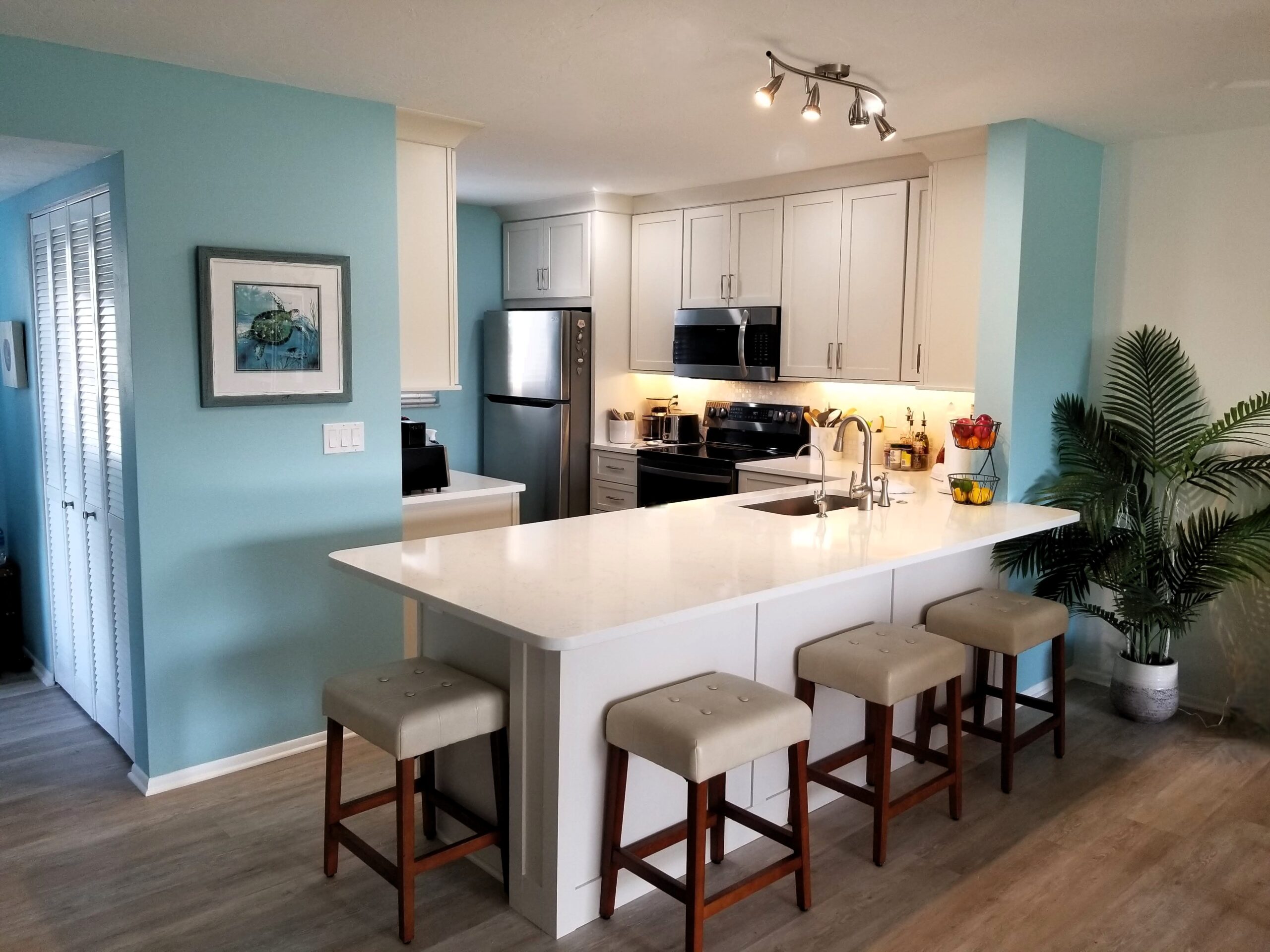 Coastal blue wall paint neutral kitchen Sarasota remodel