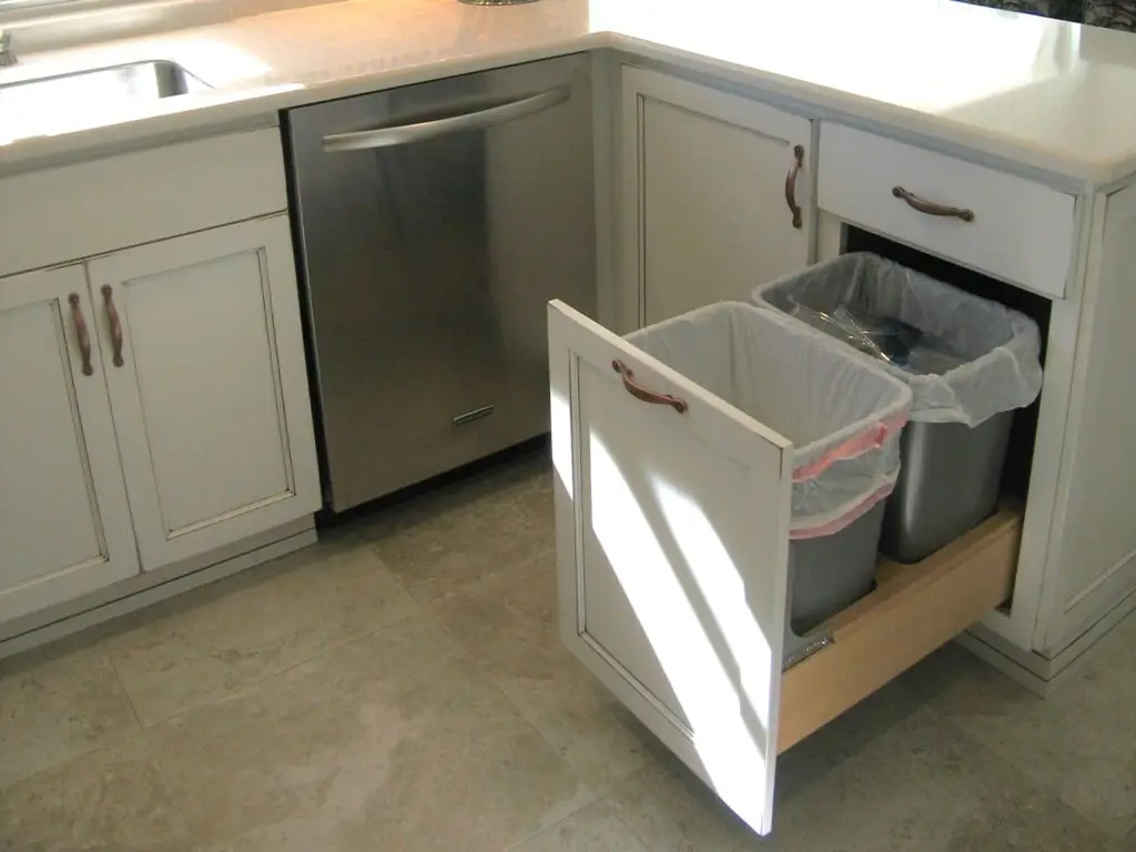 Functional kitchen storage solutions with pull out trash