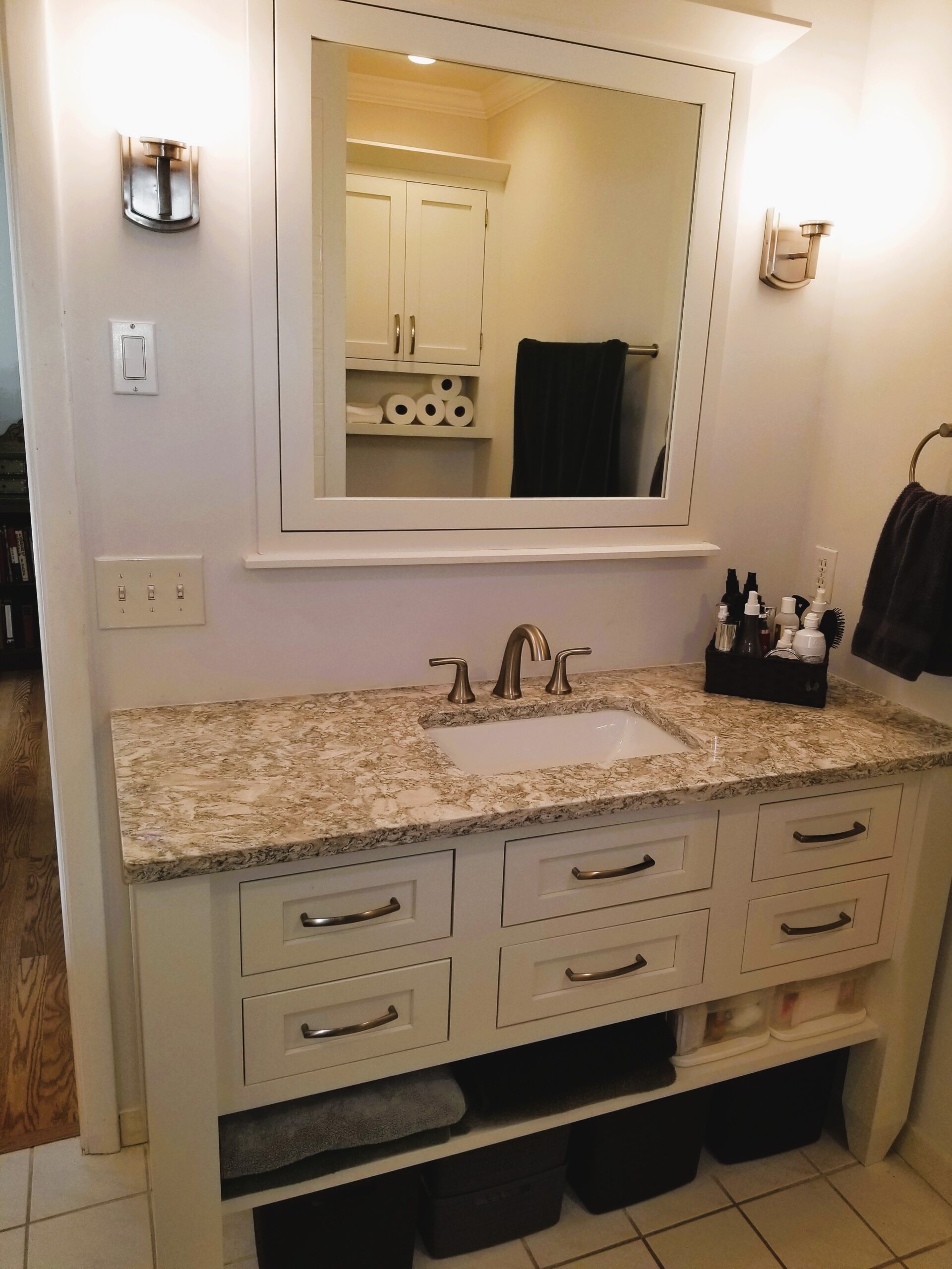 StarMark inset cabinetry white vanity with Cambria New Quay quartz countertop