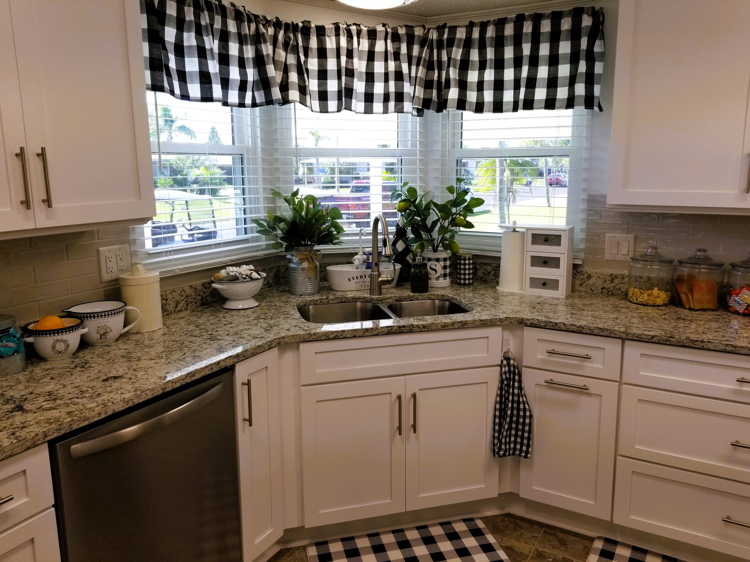 White Simplicity shaker cabinets with taupe subway tile backsplash