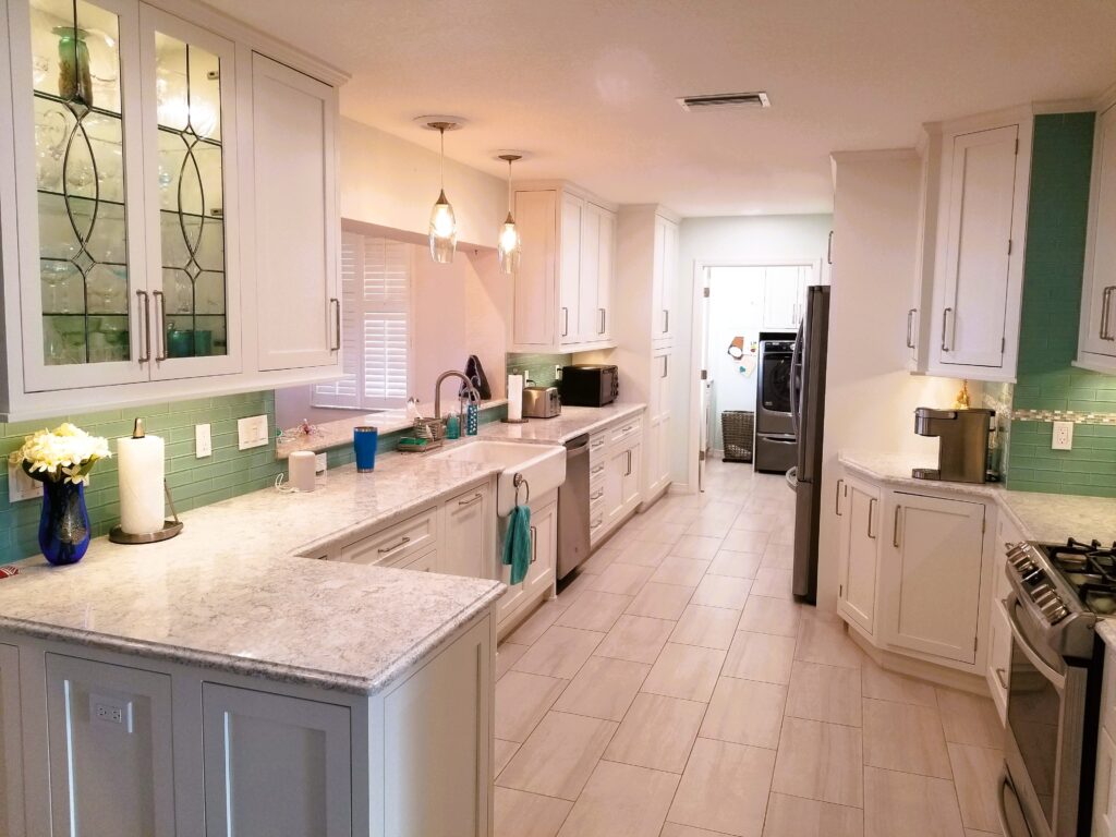 Palmetto waterfront kitchen full view with green glass backsplash and Cambria countertops