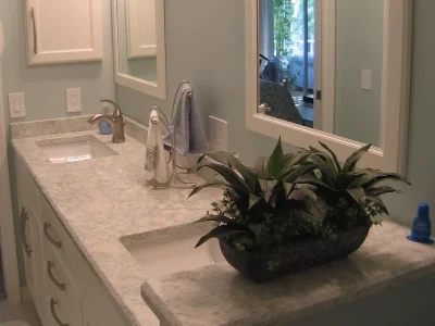 dual sink, white StarMark bathroom vanity cabinet with Cambria Montgomery quartz countertops in a Bradenton, Florida bathroom remodel