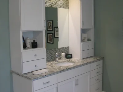 white bathroom vanity cabinets with symmetrical storage towers in a Lakewood Ranch, Florida bathroom remodel