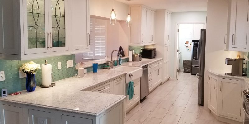 Kitchen design with white cabinets and quartz countertops
