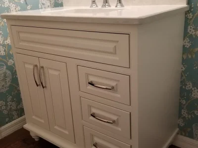 inset furniture vanity with feet and quartz countertop