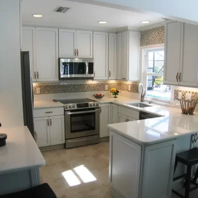 distressed white maple cabinetry in Longboat Key cottage kitchen